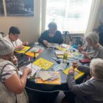 Senior residents enjoying a DIY Frame making art class